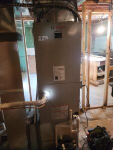 Bosch indoor HVAC system installed in a residential basement, designed for efficient heating and cooling in all seasons.