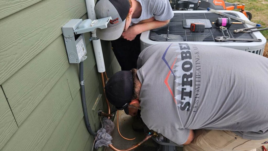 Strobel HVAC Technicians Providing a Routine Maintenance Service